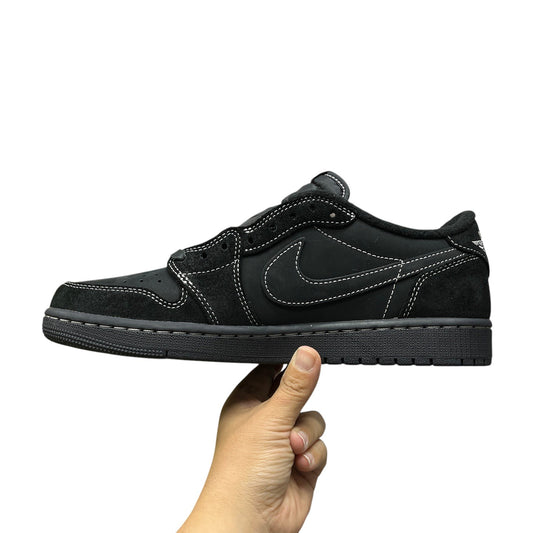 Luxury Chef Air Jordan 1 Low Travis Scott black suede and leather sneakers with white contrast stitching.