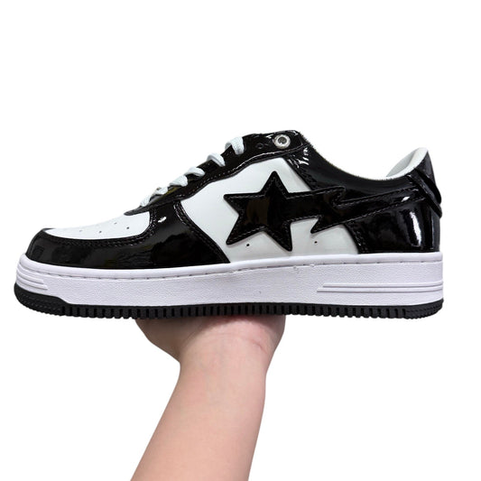 Luxury Chef BAPESTA black and white patent leather sneakers with star detail and white laces.