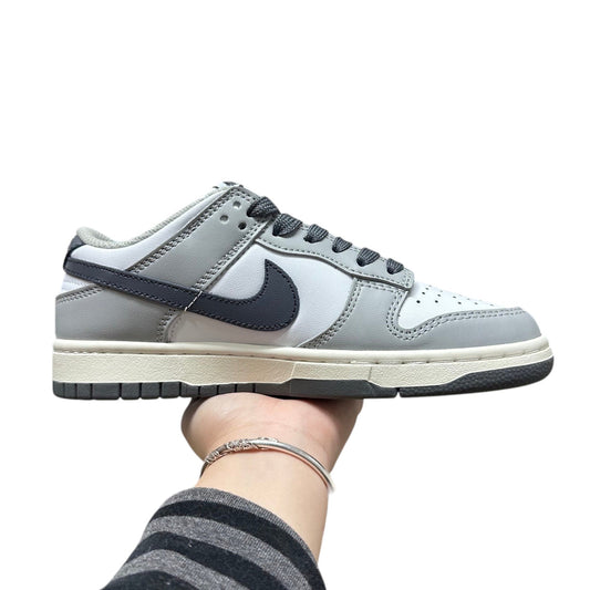 Luxury Chef Nike Dunk Low grey and white leather sneakers with dark grey swoosh and laces.