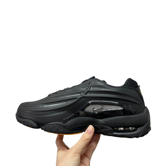 Luxury Chef NOCTA HOT STEP black sneakers with mesh detailing and orange sole. Athletic footwear.