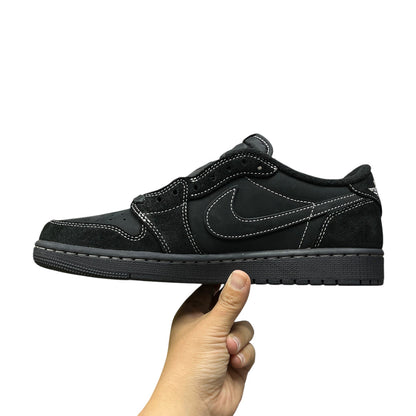 Luxury Chef Air Jordan 1 Low Travis Scott black suede and leather sneakers with white contrast stitching.