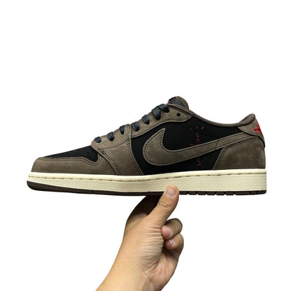 Luxury Chef Air Jordan 1 Low Travis Scott sneakers in brown and black suede with red accents and signature stitching.