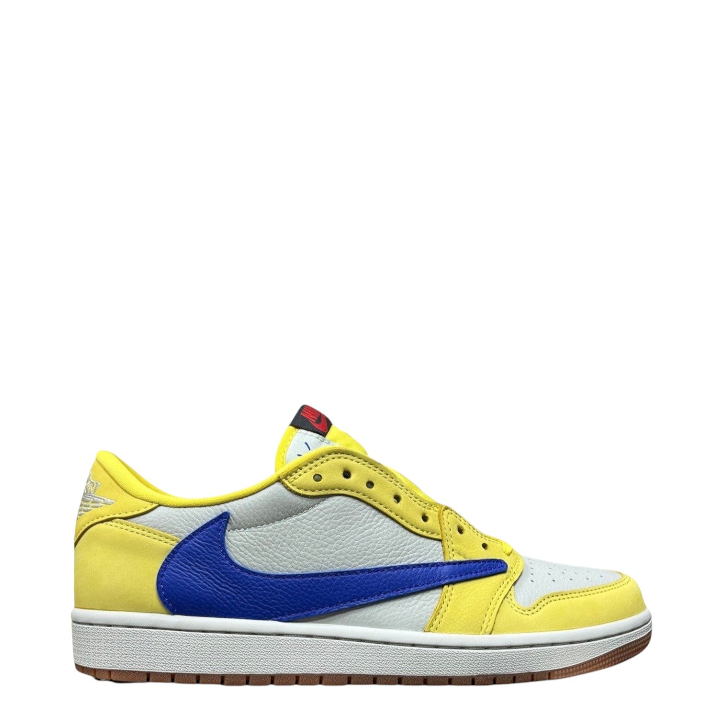 Luxury Chef Air Jordan 1 Low Travis Scott sneakers in yellow and white leather with a blue swoosh.