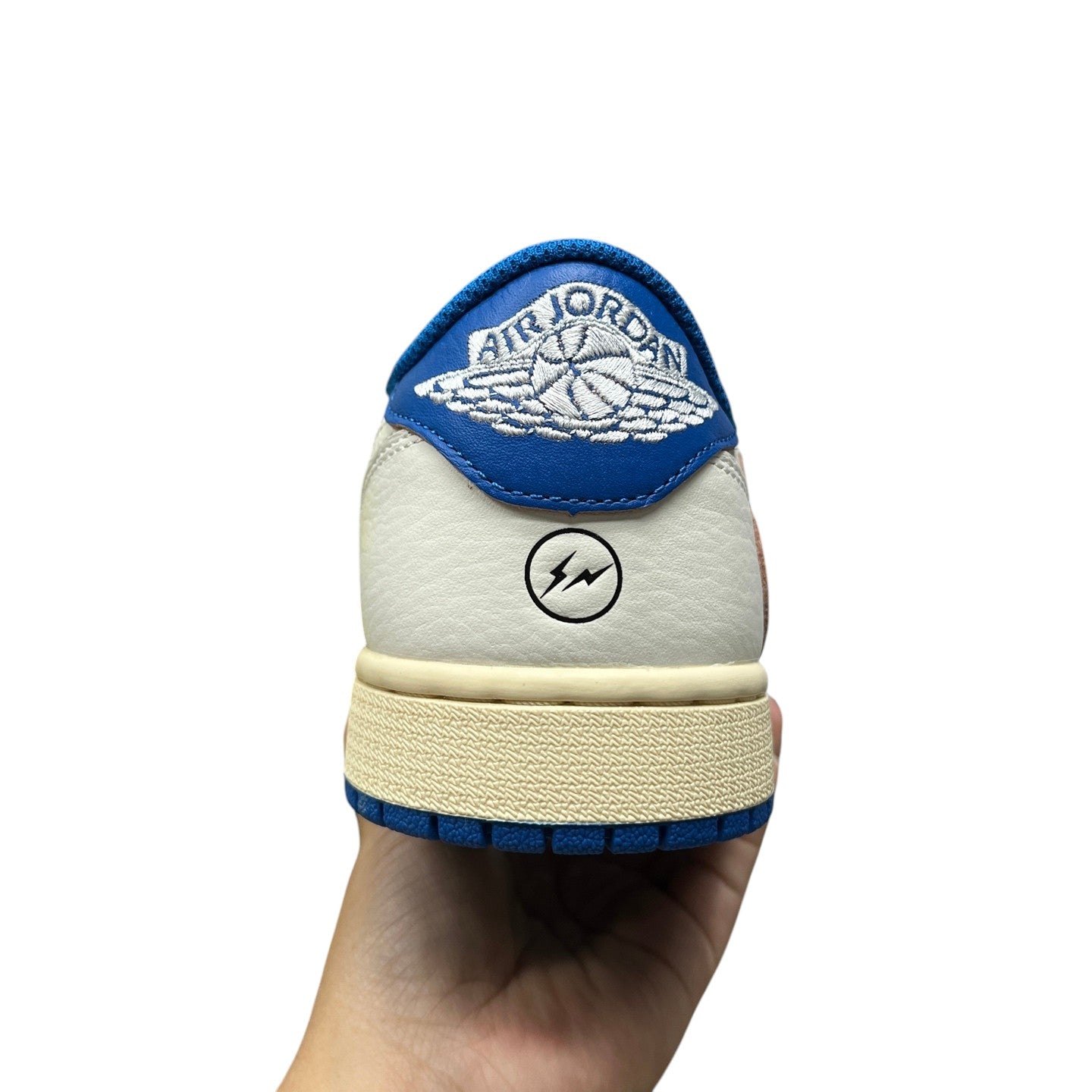 Luxury Chef Air Jordan 1 Travis Scott sneakers with blue trim, white leather and lightning bolt logo.