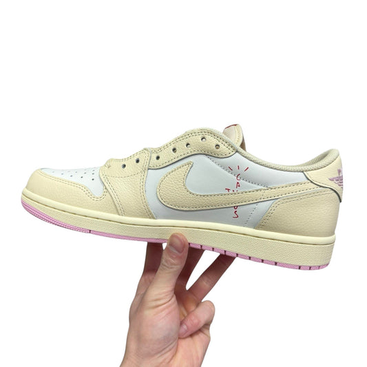 Luxury Chef Air Jordan 1 Low Travis Scott sneakers in cream and white leather with pink accents and red stitching.