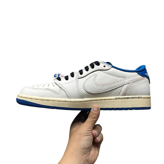 Luxury Chef Air Jordan 1 Low Travis Scott sneakers in white tumbled leather with blue accents and cream sole.