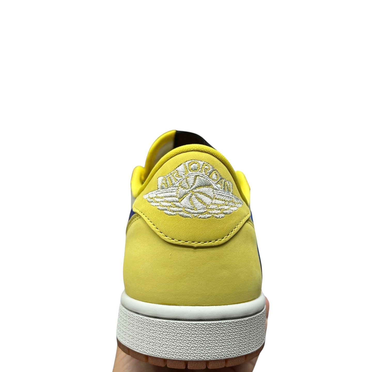 Luxury Chef yellow Air Jordan 1 Travis Scott low-top sneakers with blue accents and white "Air Jordan Wings" logo.