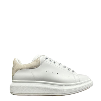 Luxury Chef Alexander McQueen white leather sneakers with beige crocodile-embossed heel tab and chunky sole.