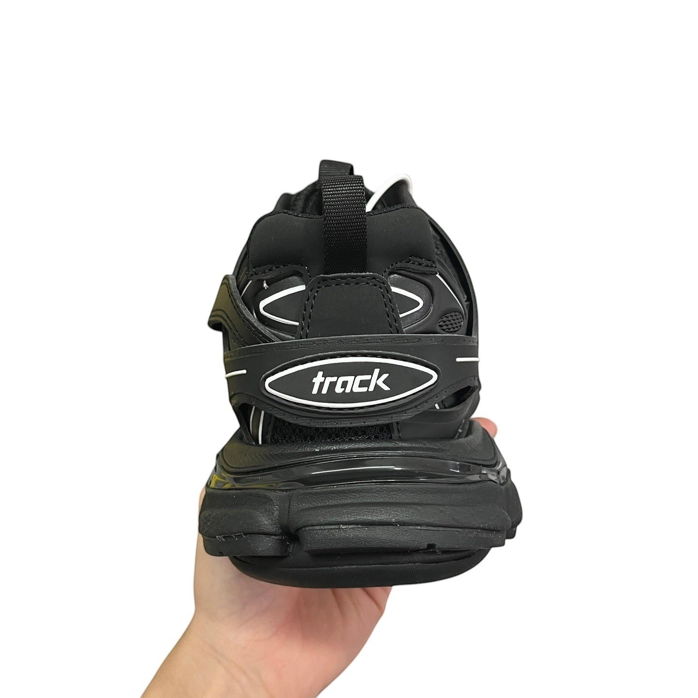 Luxury Chef BALENCIAGA TRACK black athletic sneakers with white accents and 'track' logo detail.