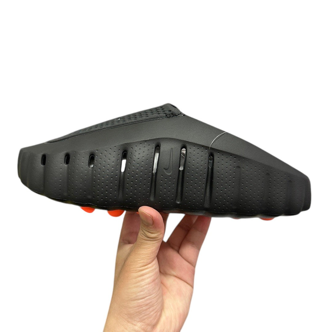 Luxury Chef black foam clogs with orange sole accents and Nike swoosh detail.