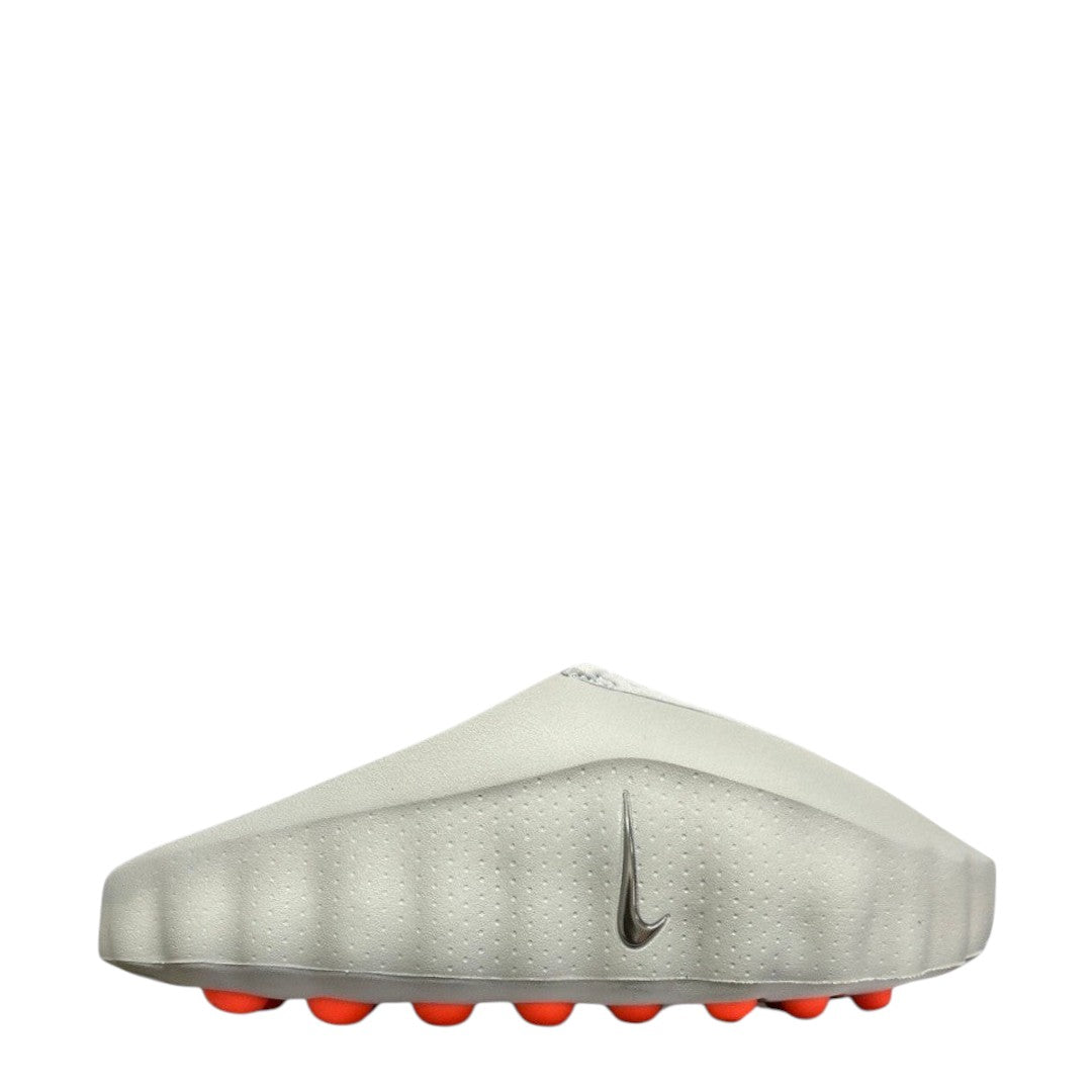 Luxury Chef light grey Nike Mind 001 golf shoes with orange spikes and a metallic swoosh logo.
