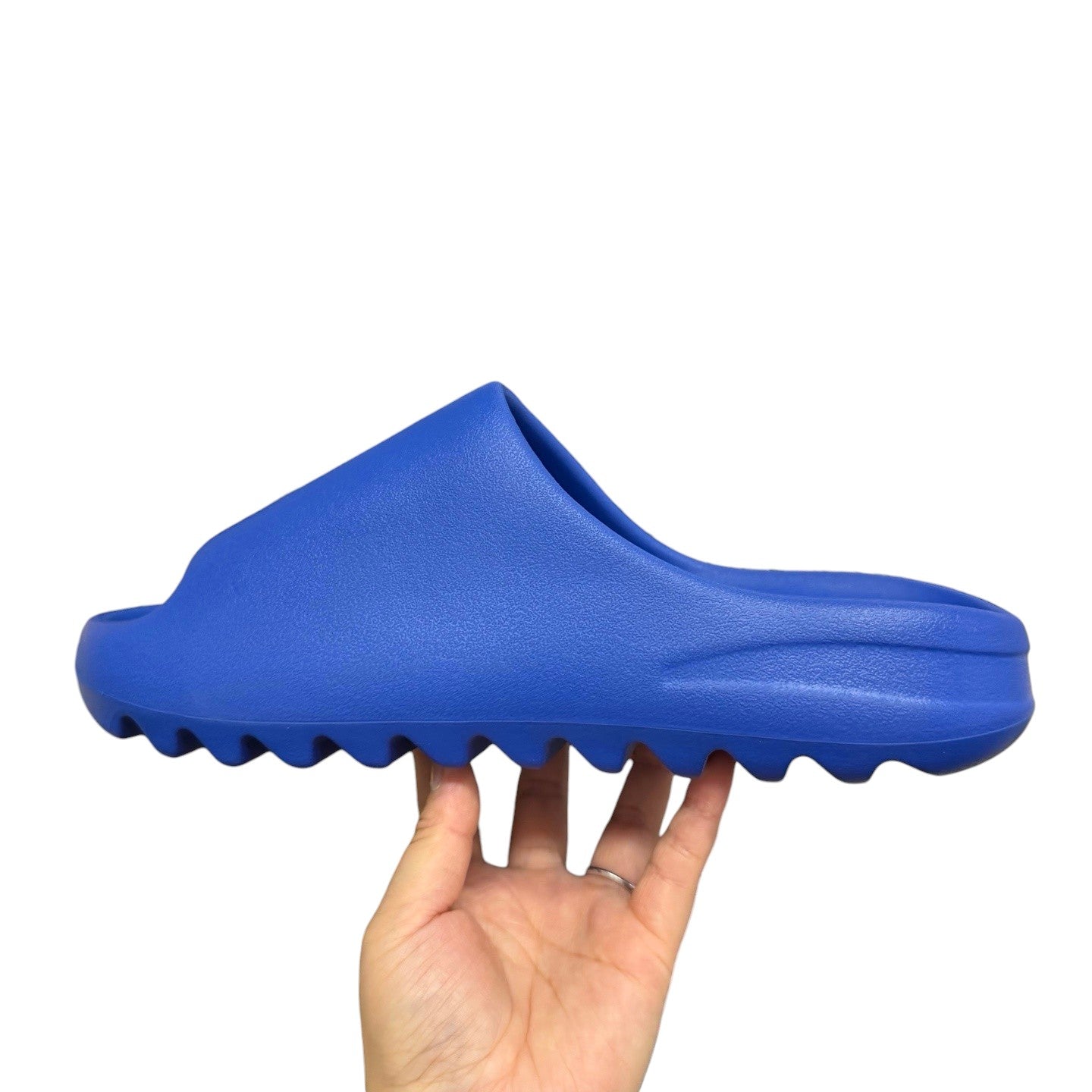 Luxury Chef royal blue EVA foam YEEZY SLIDE with a contoured footbed and jagged sole.