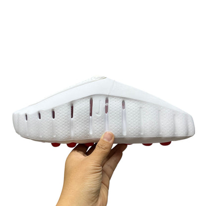Luxury Chef white YEEZY FOAM RNNR clogs with red sole accents and perforated details.