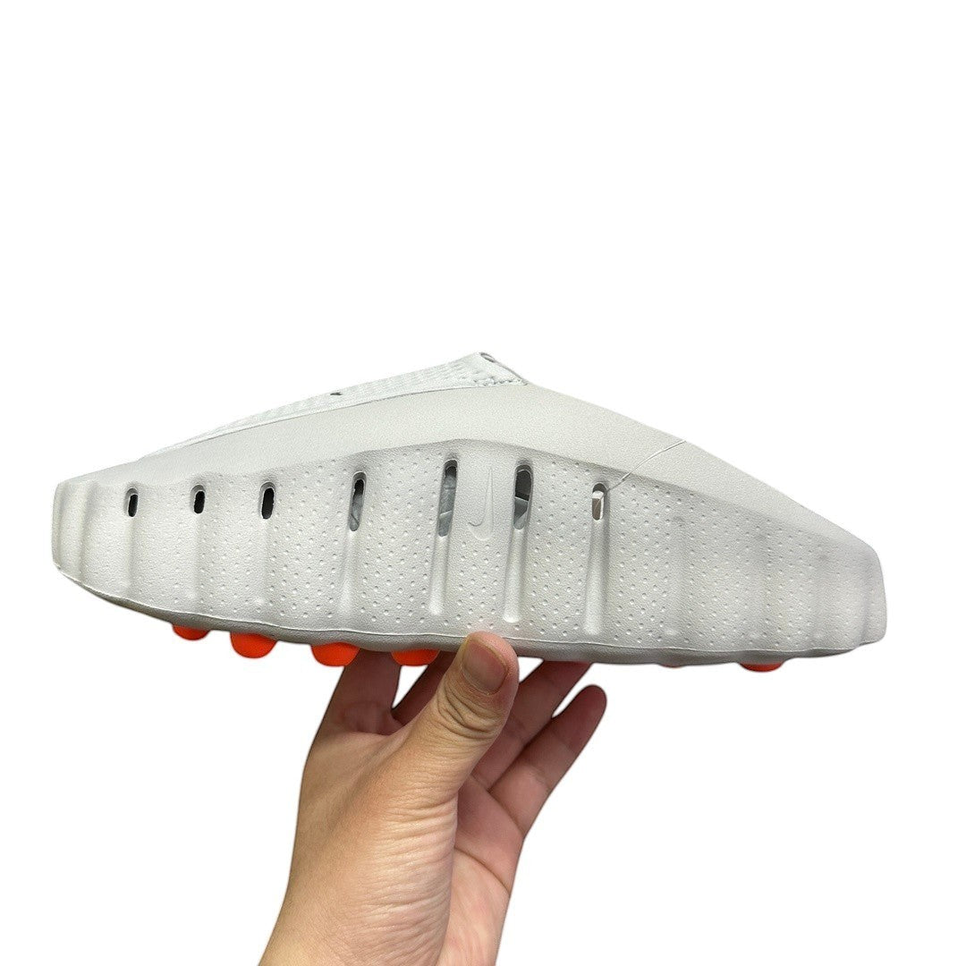 Luxury Chef YEEZY FOAM RNNR white slip-on clogs with orange sole accents and ventilation holes.