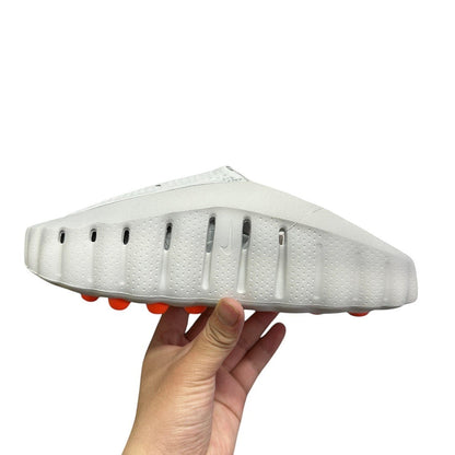 Luxury Chef YEEZY FOAM RNNR white slip-on clogs with orange sole accents and ventilation holes.