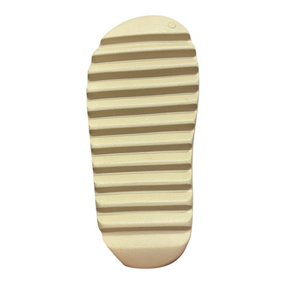 Luxury Chef YEEZY SLIDE in beige, featuring a textured sole for grip. Comfortable slip-on design.