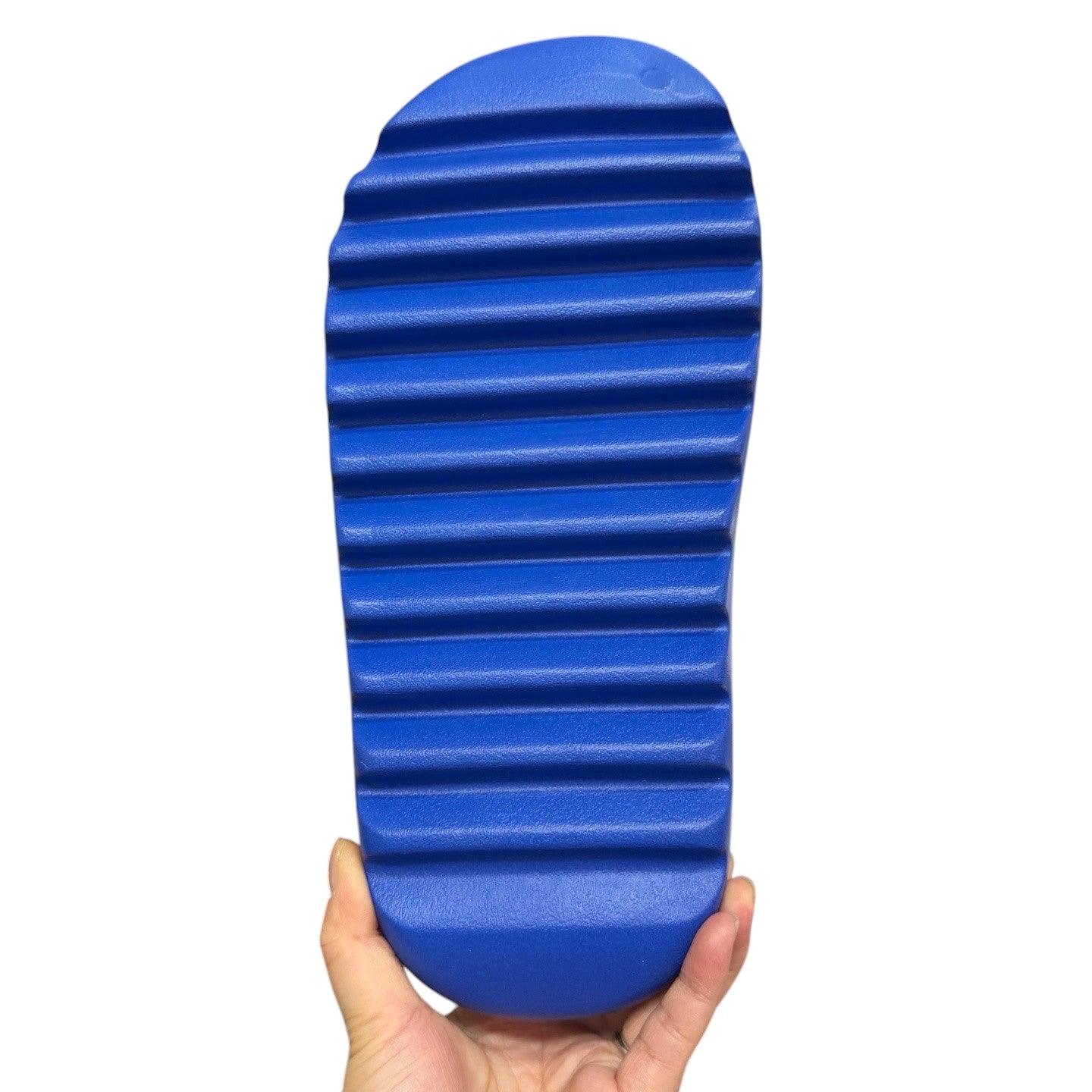 Luxury Chef YEEZY SLIDE in bright blue, featuring a thick, ribbed sole for grip and comfort.