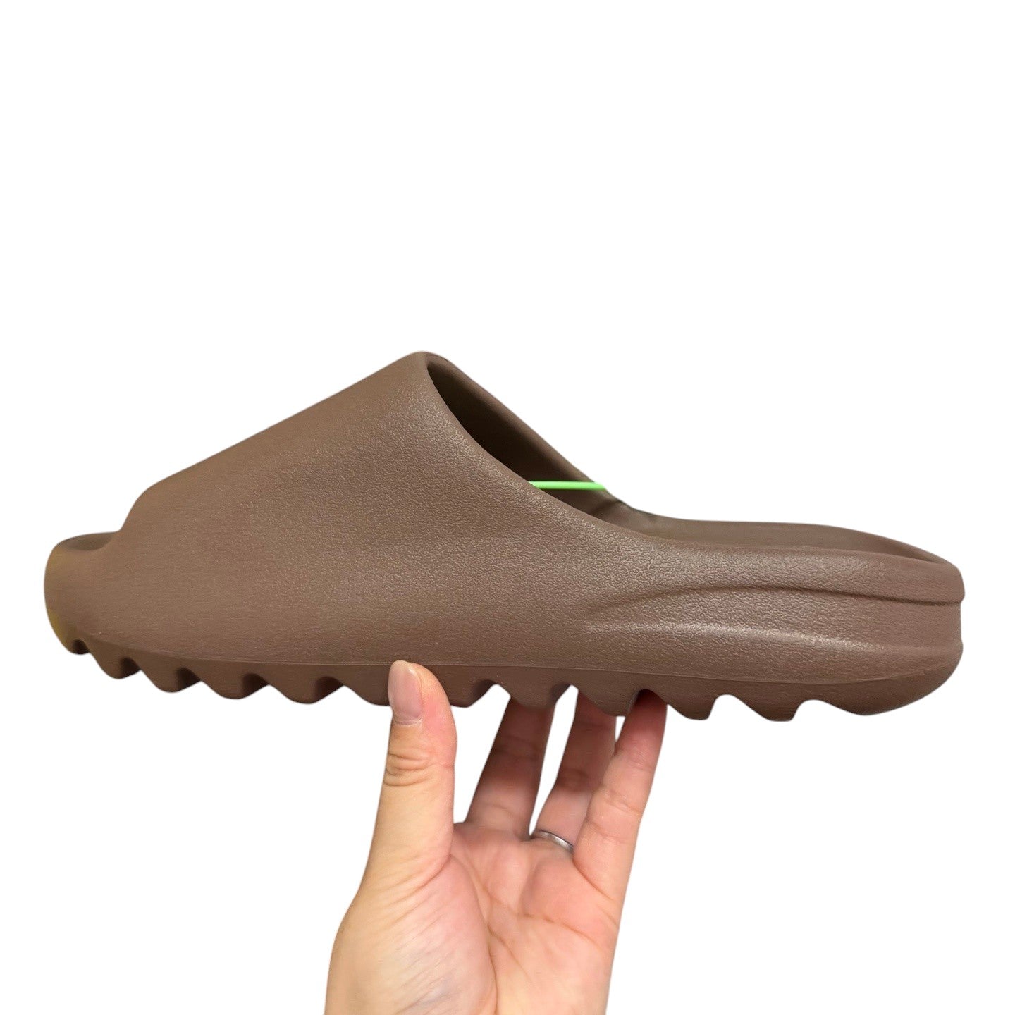Luxury Chef YEEZY SLIDE in a matte brown, made of foam with a contoured footbed and ridged sole.