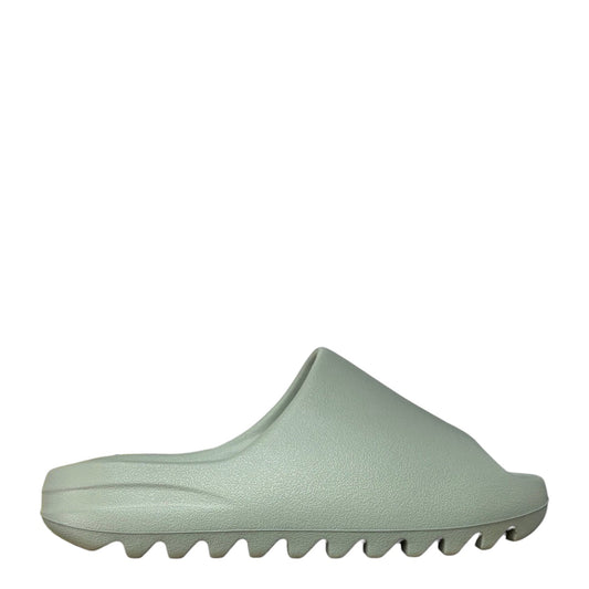 Luxury Chef YEEZY SLIDE in a light sage green EVA foam. Features a contoured footbed and serrated sole.