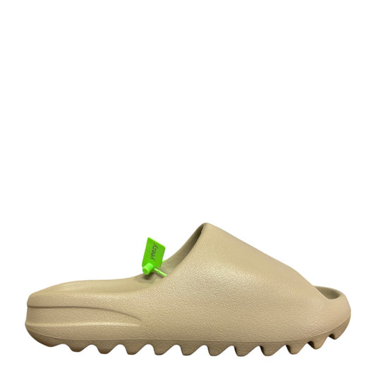 Luxury Chef YEEZY SLIDE in a neutral tan color, made of EVA foam with a comfortable slip-on design.