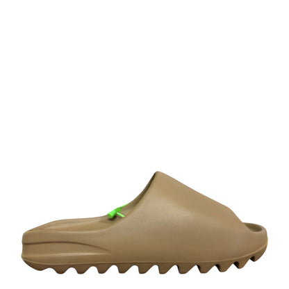 Luxury Chef YEEZY SLIDE in a taupe brown color, made of EVA foam with a contoured footbed and serrated sole.