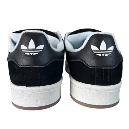 Luxury Chef black suede and leather Adidas Campus sneakers with white soles and Adidas trefoil logo on heel.