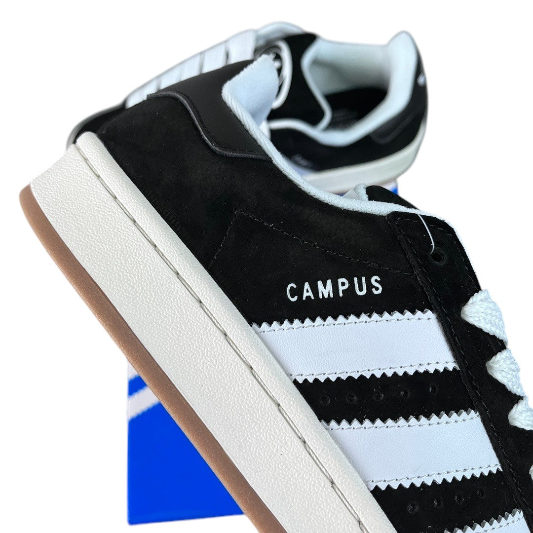 Luxury Chef black suede and white leather Adidas Campus sneakers with gum sole and white laces.
