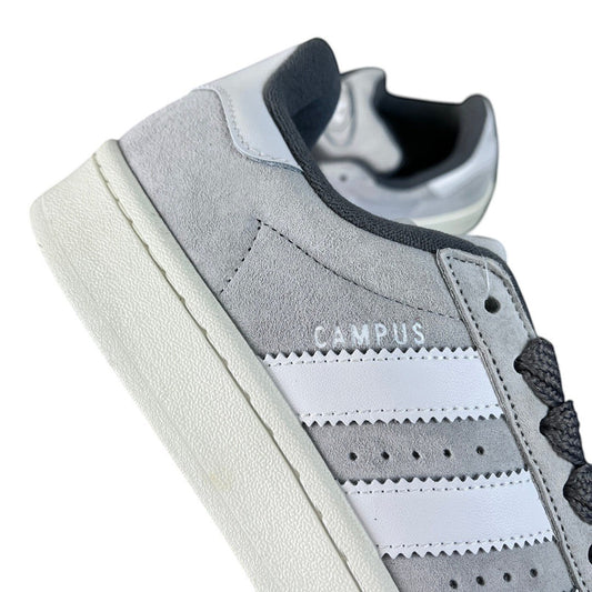 Luxury Chef Adidas Campus grey suede sneakers with white stripes and white sole. Casual footwear.