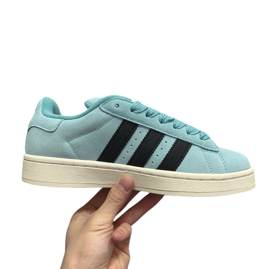 Luxury Chef Adidas Campus light blue suede sneakers with black stripes and cream sole.
