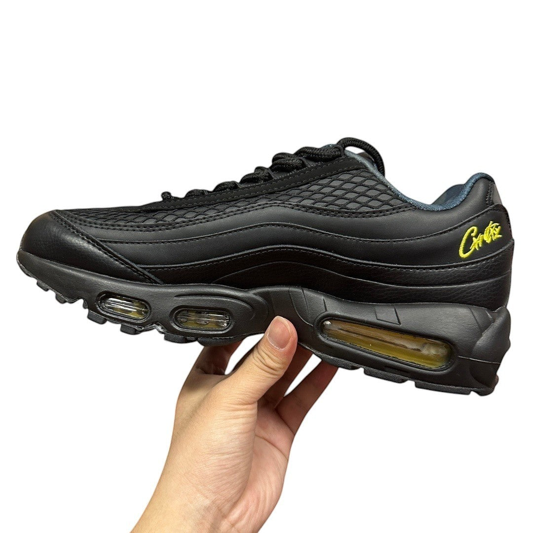 Luxury Chef AIR MAX 95 CORTEIZ black leather and mesh sneakers with yellow accents and visible air cushioning.
