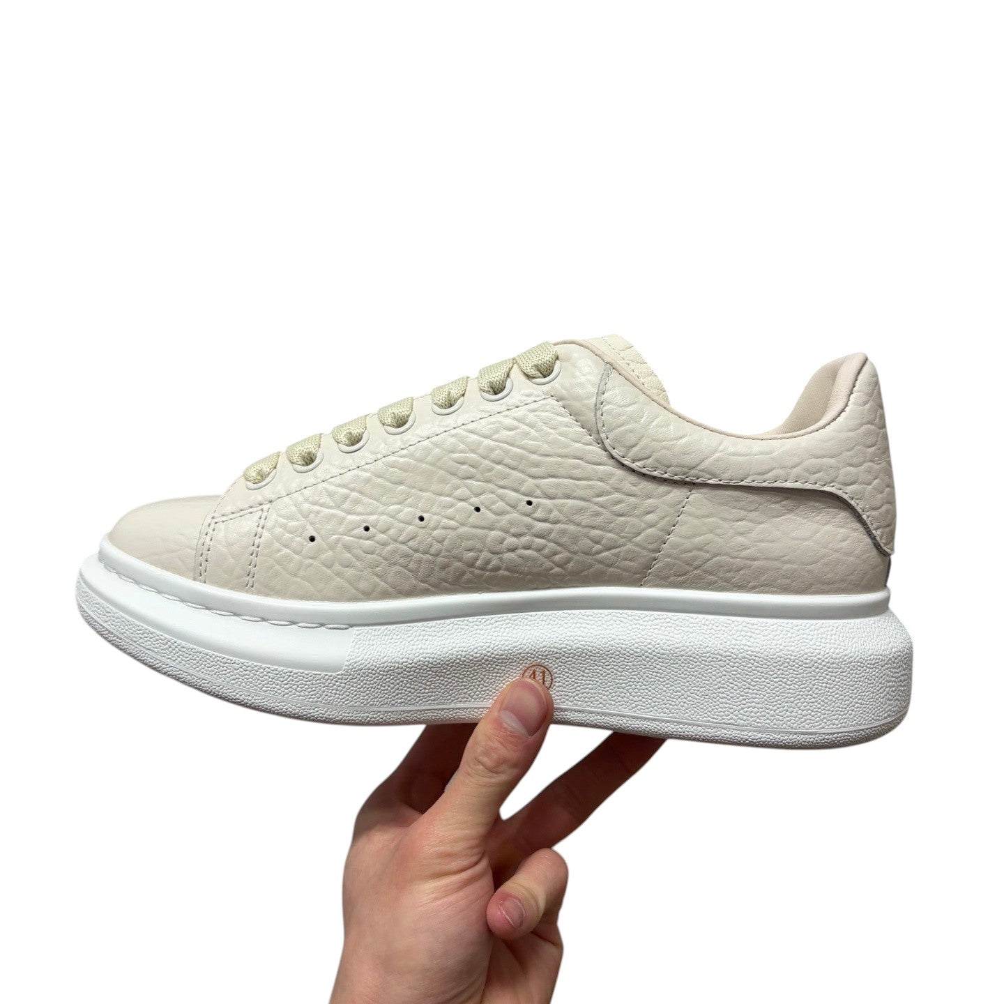 Luxury Chef Alexander McQueen oversized sole sneakers in textured cream leather with tonal laces.