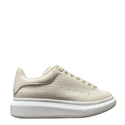 Luxury Chef Alexander McQueen oversized sole sneakers in textured off-white leather with a chunky white sole.