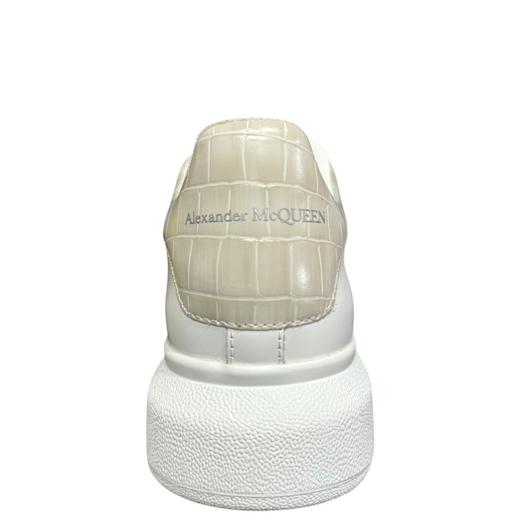Luxury Chef Alexander McQueen white leather sneakers with beige crocodile-embossed heel detail.