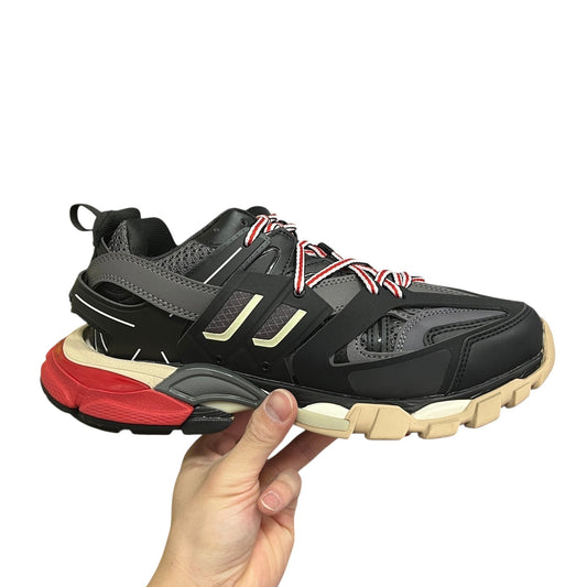 Luxury Chef Balenciaga Track sneakers in black, grey, red, and beige. Multi-material construction with dynamic lacing.
