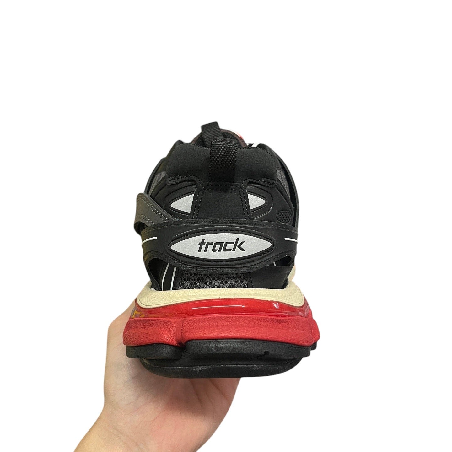 Luxury Chef BALENCIAGA TRACK sneakers with black, grey, and red accents. Features a layered sole and breathable mesh.