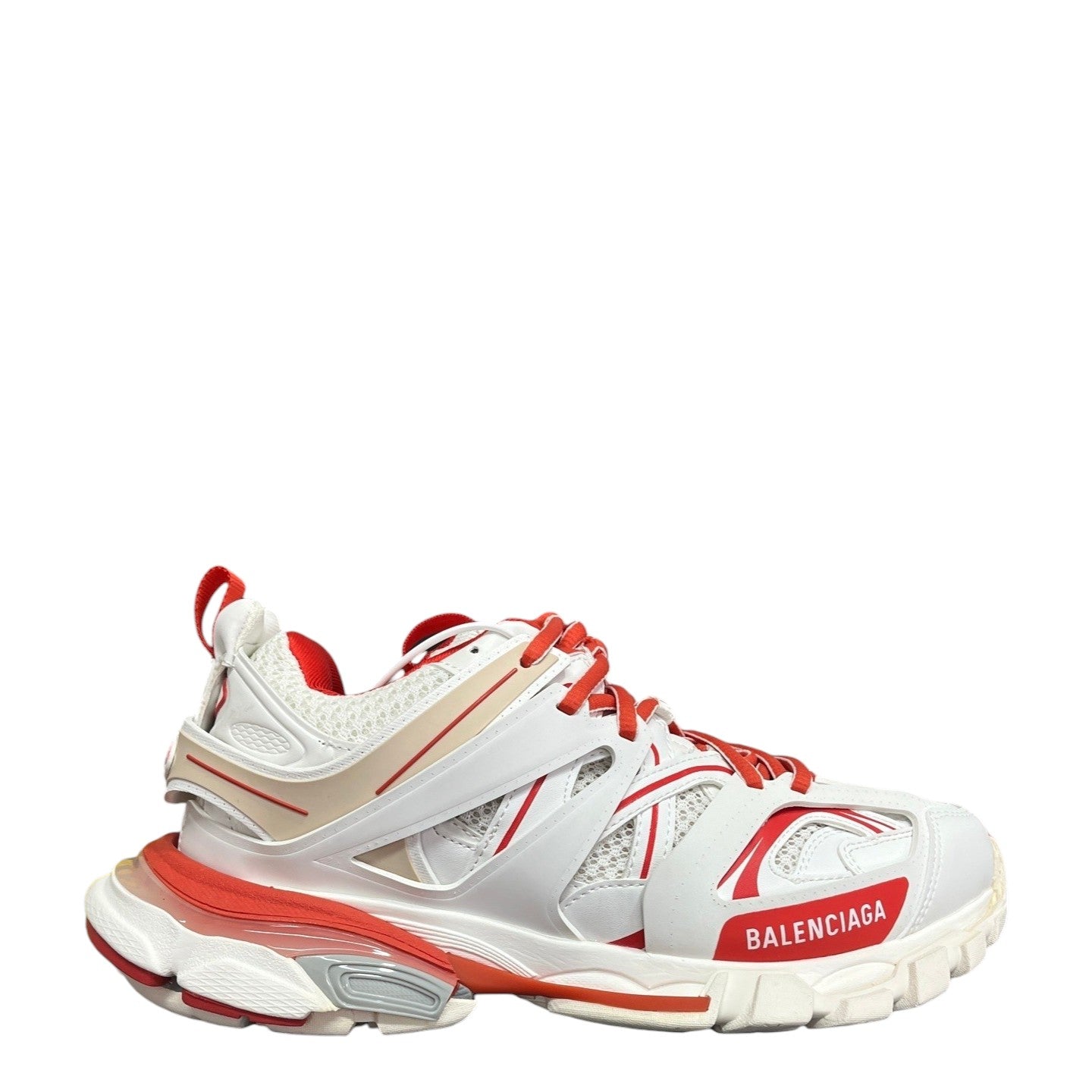 Luxury Chef Balenciaga Track sneakers in white, red, and beige mesh and rubber with a chunky sole.