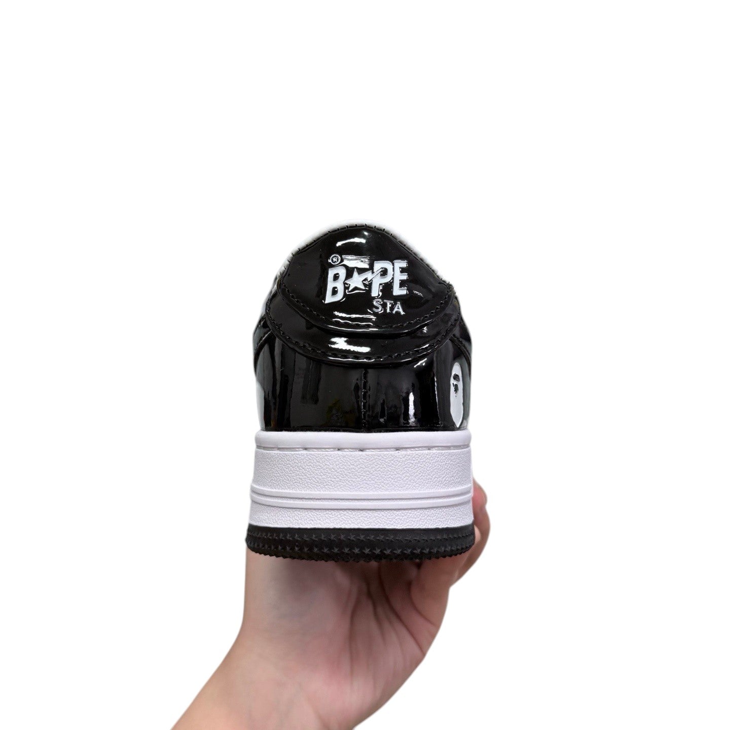 Luxury Chef BAPESTA black patent leather sneakers with white sole and BAPE STA logo.