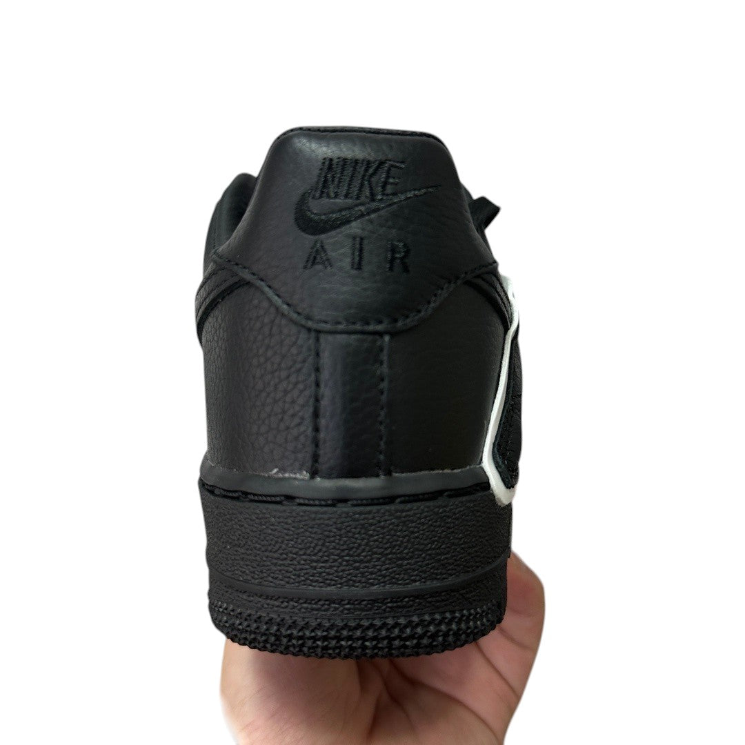 Luxury Chef black leather Nike Air Force 1 CPFM sneakers with white accents.