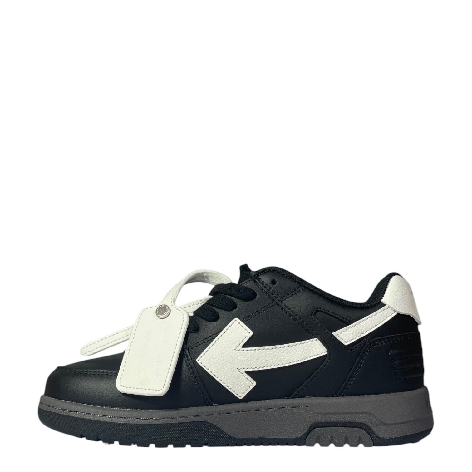 Luxury Chef black leather low-top sneakers with white arrow logo and tag. Grey sole.