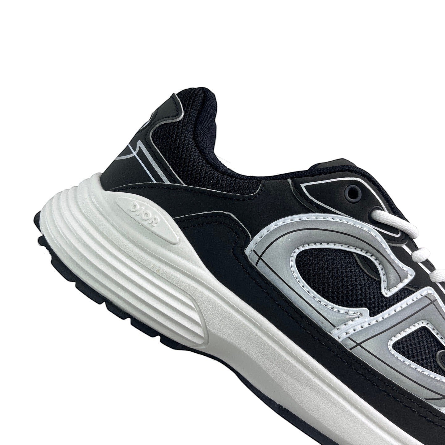 Luxury Chef DIOR B30 black and silver mesh and leather sneakers with white soles.