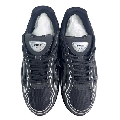 Luxury Chef DIOR B30 black mesh and leather sneakers with white flame detailing and silver logo.