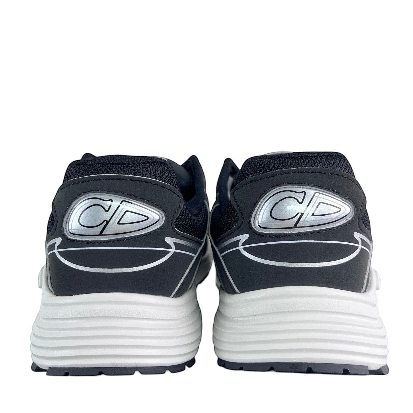 Luxury Chef DIOR B30 black mesh and leather sneakers with silver CD logo detail and white sole.