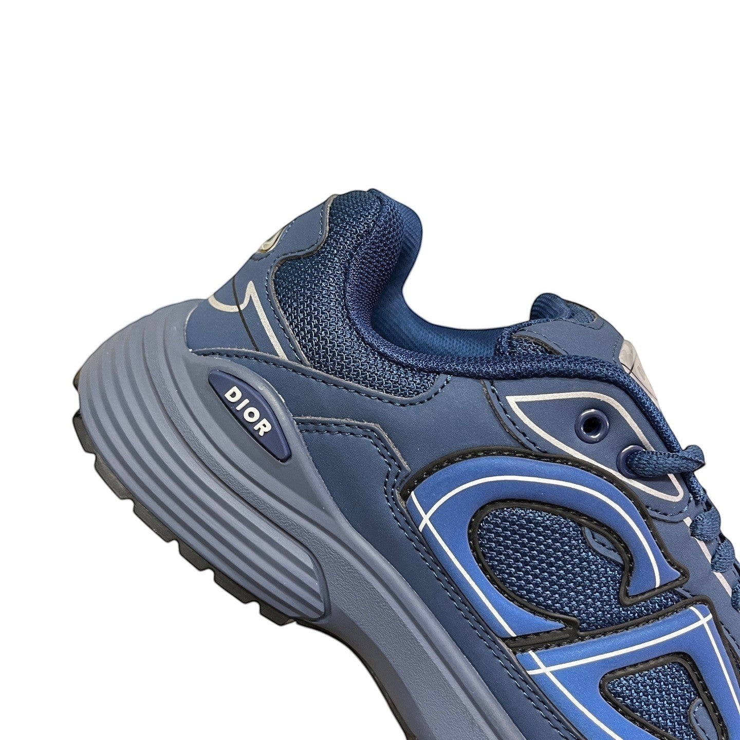 Luxury Chef DIOR B30 navy blue mesh and leather sneakers with white accents and a chunky sole.