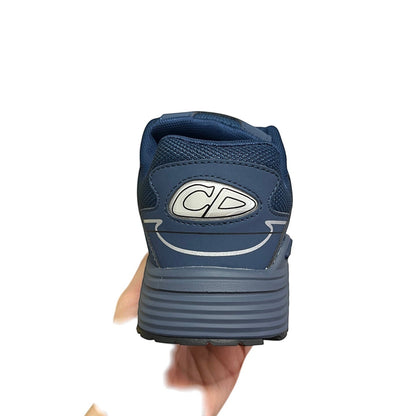 Luxury Chef DIOR B30 navy blue athletic sneakers with CD logo detail and reflective accents.