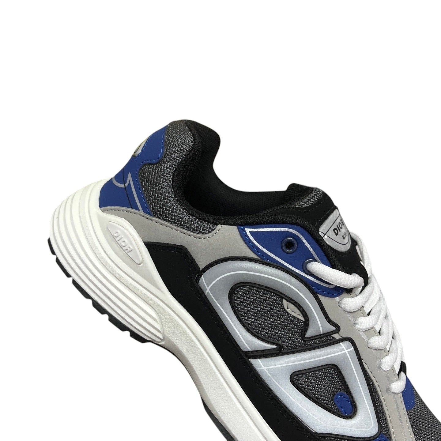 Luxury Chef DIOR B30 sneakers with grey, black, and blue accents. Features a chunky white sole and mesh detailing.