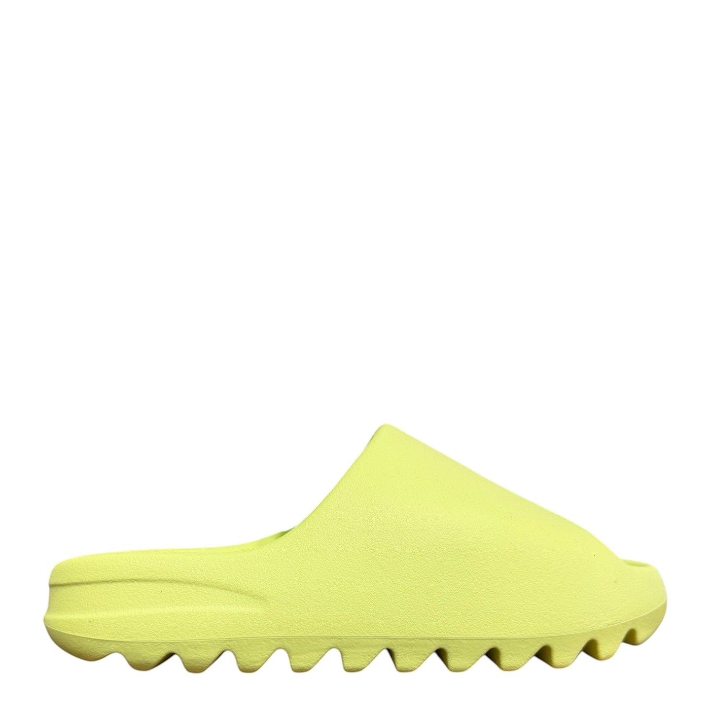 Luxury Chef YEEZY SLIDE in bright green, made of EVA foam with a contoured footbed and serrated sole.