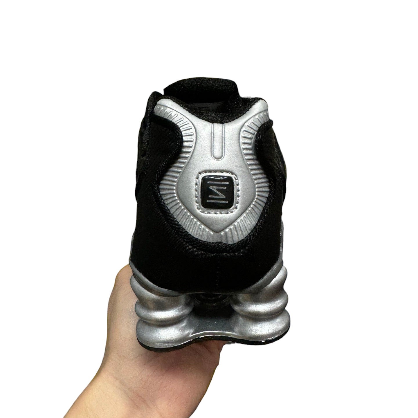 Luxury Chef KOBE 6 black and silver sneakers with unique segmented sole and distinctive heel logo.