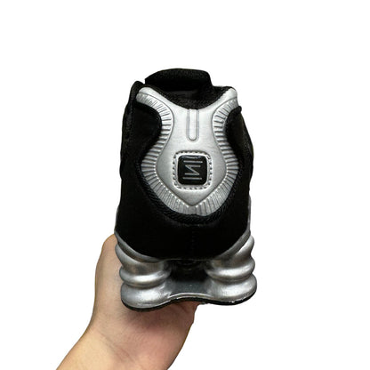 Luxury Chef KOBE 6 black and silver sneakers with unique segmented sole and distinctive heel logo.