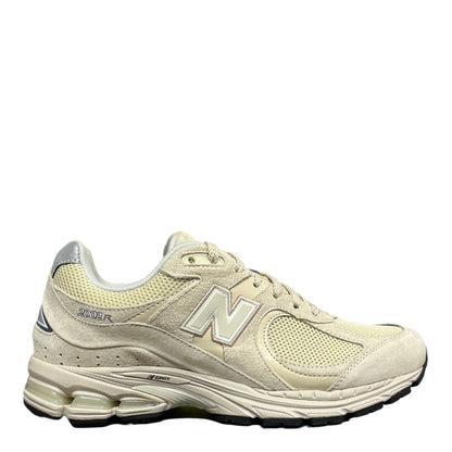 Luxury Chef New Balance 2002R beige suede and mesh sneakers with N logo and ENERZY sole.