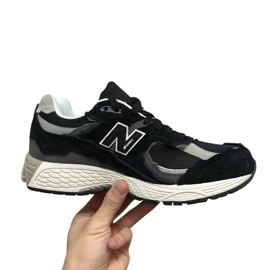 Luxury Chef New Balance 2002R black suede and mesh sneakers with white accents and N logo.